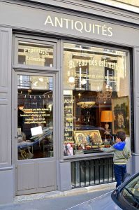 Small_boy_wistful_at_toy_store_window,_Paris_May_2014