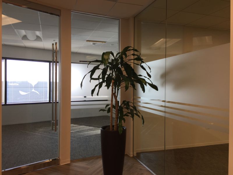 etched glass graphics and a 3D lobby logo move in Costa Mesa