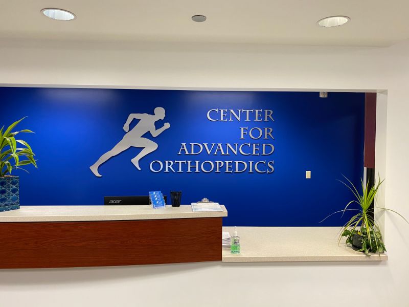 brushed metal office logo signs in Cerritos