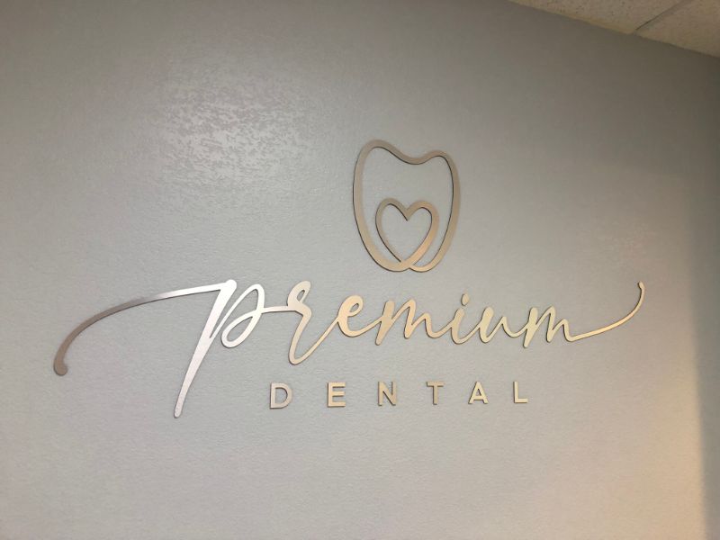 Brushed Metal Lobby Logo Sign Welcomes Visitors to Irvine, CA Dentistry