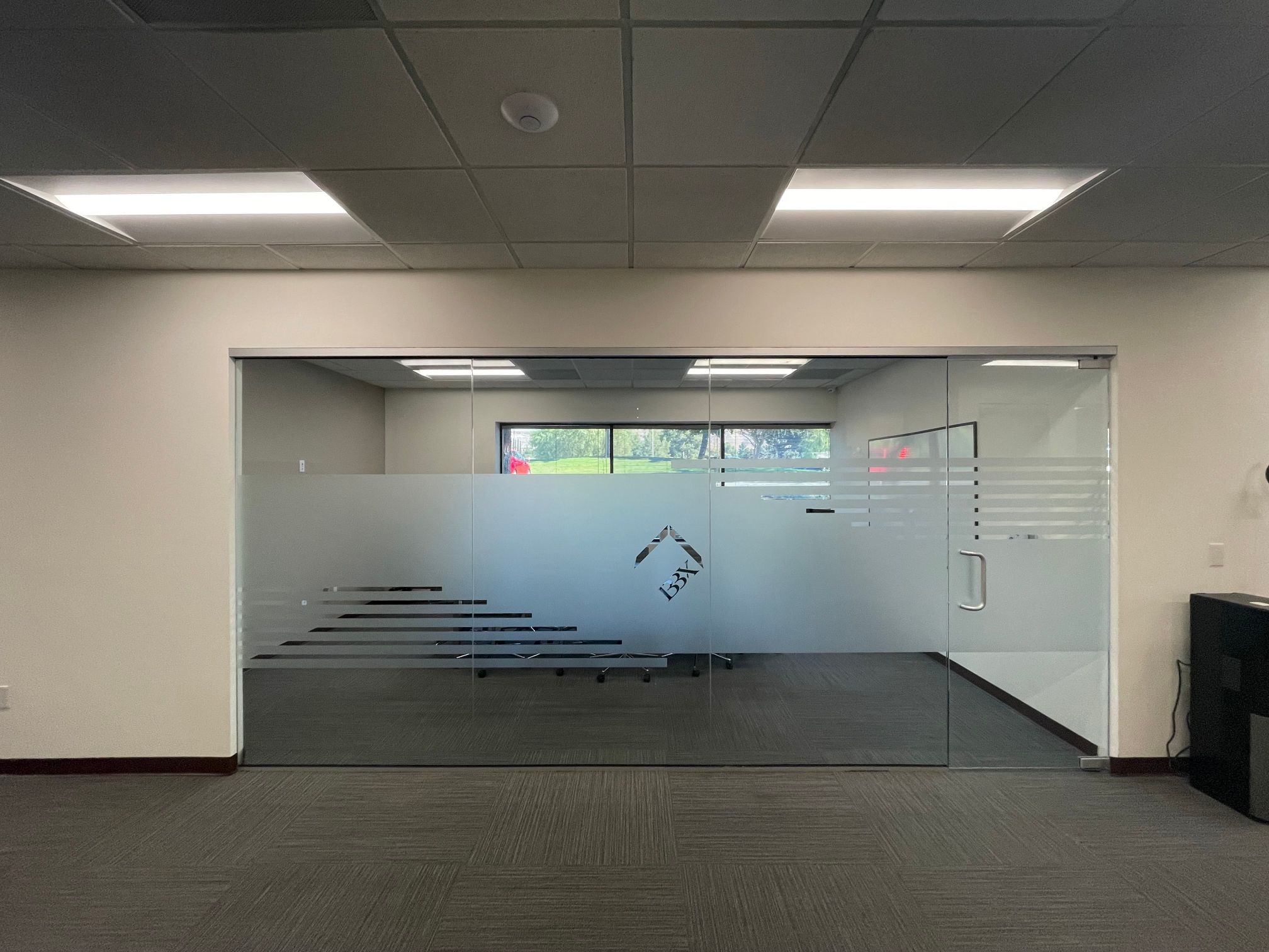 Frosted and Etched Glass Graphics for Offices in Los Angeles Provides Branding and Privacy